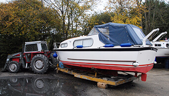 A Freeman 23 being pulled out of the water at Sheridan Marine for winter storage.