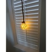 LED Mottled Glass Christmas Bauble with Hemp Rope Hanging in a Window with LED Lights